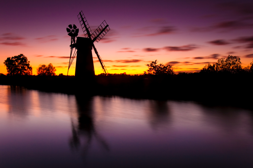 Turf Fen Windmill on the Norfolk Broads against a red evening sky