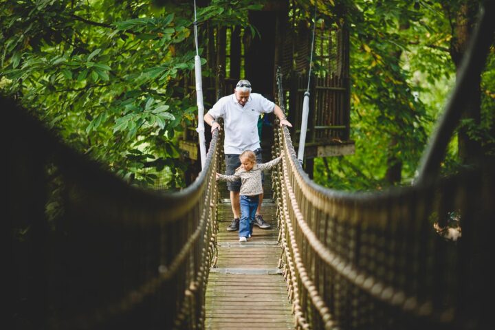 Dad and child on bridge at BeWILDerwood, Norfolk