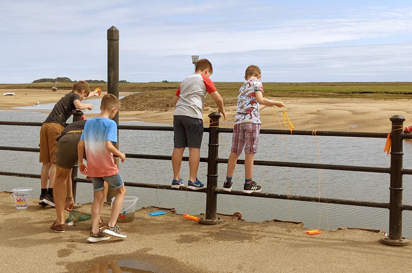 Family crabbing at Wells Harbour, Norfolk